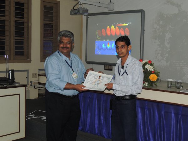 Dr. Amit Lad receiving the Guzdar Young Scientist Award~